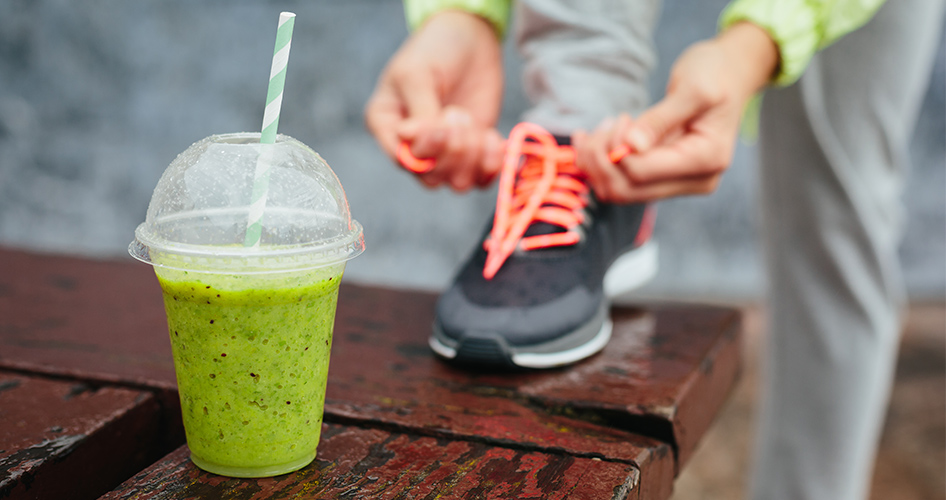 fitness woman with cleansing and detoxifying drink